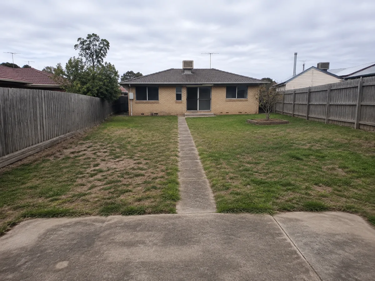 Unlandscaped fictional suburban backyard before AI landscape design