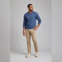 Fictional adult demonstrating a head turn, hand-on-hip stance, and contrapposto weight shift
